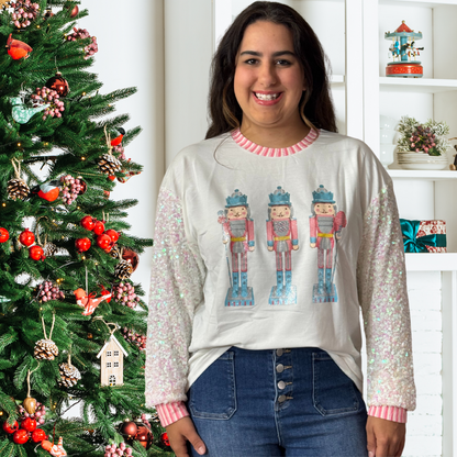 Glittery Nutcrackers on White Top with Sequin Sleeves by Emma+ Grace