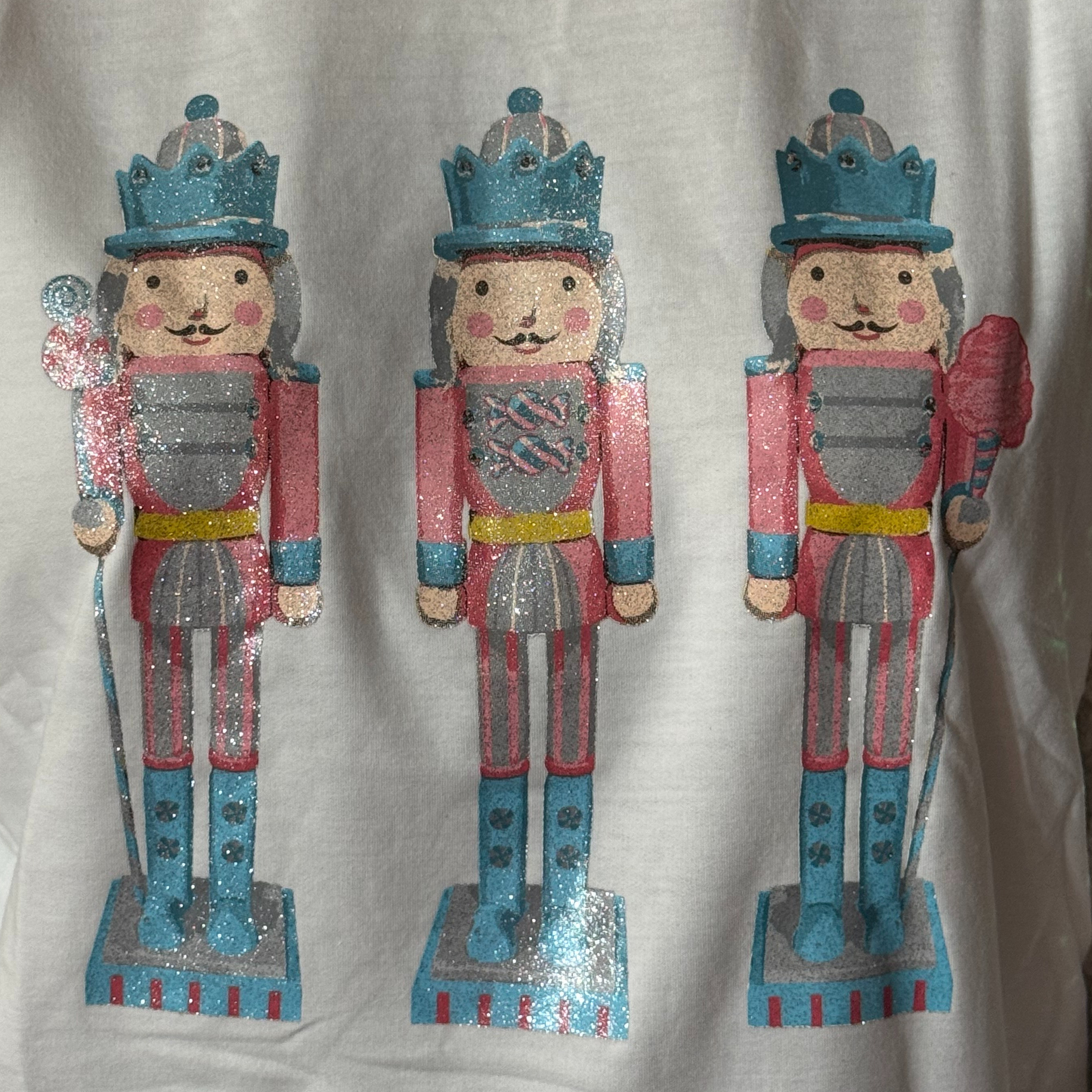 Glittery Nutcrackers on White Top with Sequin Sleeves by Emma+ Grace